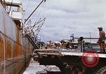 Image of Unloading of oil barrels Saigon Vietnam, 1966, second 39 stock footage video 65675037335