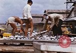 Image of Unloading of oil barrels Saigon Vietnam, 1966, second 43 stock footage video 65675037335