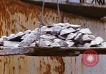 Image of Unloading of oil barrels Saigon Vietnam, 1966, second 47 stock footage video 65675037335