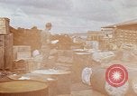 Image of oil barrels Saigon Vietnam, 1966, second 4 stock footage video 65675037340
