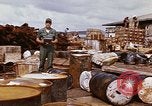 Image of oil barrels Saigon Vietnam, 1966, second 40 stock footage video 65675037340