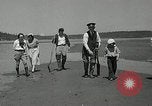 Image of goeduck clam digging Tacoma Washington USA, 1935, second 13 stock footage video 65675037671
