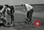 Image of goeduck clam digging Tacoma Washington USA, 1935, second 18 stock footage video 65675037671