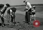 Image of goeduck clam digging Tacoma Washington USA, 1935, second 19 stock footage video 65675037671