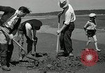 Image of goeduck clam digging Tacoma Washington USA, 1935, second 20 stock footage video 65675037671