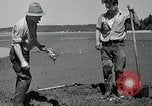 Image of goeduck clam digging Tacoma Washington USA, 1935, second 31 stock footage video 65675037671