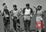 Image of goeduck clam digging Tacoma Washington USA, 1935, second 32 stock footage video 65675037671