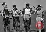 Image of goeduck clam digging Tacoma Washington USA, 1935, second 33 stock footage video 65675037671