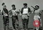 Image of goeduck clam digging Tacoma Washington USA, 1935, second 34 stock footage video 65675037671