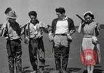 Image of goeduck clam digging Tacoma Washington USA, 1935, second 35 stock footage video 65675037671