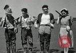 Image of goeduck clam digging Tacoma Washington USA, 1935, second 36 stock footage video 65675037671