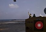 Image of Kitty Hawk flight deck operations Pacific Ocean, 1971, second 13 stock footage video 65675037823