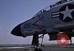 Image of Kitty Hawk flight deck operations Pacific Ocean, 1971, second 22 stock footage video 65675037823