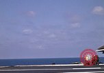 Image of Kitty Hawk flight deck operations Pacific Ocean, 1971, second 54 stock footage video 65675037823