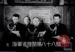 Image of Japanese admirals appeal by radio to defense workers Japan, 1944, second 4 stock footage video 65675037851