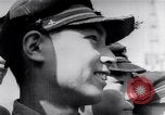 Image of Japanese admirals appeal by radio to defense workers Japan, 1944, second 59 stock footage video 65675037851