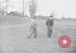 Standbild Mann und Frau mit zwei Hunden United States USA, 1948, aus Sekunde 7 historischem Filmmaterial Videoclip 65675037951