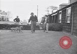 Standbild Mann und Frau mit zwei Hunden United States USA, 1948, aus Sekunde 10 historischem Filmmaterial Videoclip 65675037951