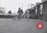 Standbild Mann und Frau mit zwei Hunden United States USA, 1948, aus Sekunde 11 historischem Filmmaterial Videoclip 65675037951