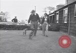 Standbild Mann und Frau mit zwei Hunden United States USA, 1948, aus Sekunde 13 historischem Filmmaterial Videoclip 65675037951