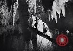 Image of Queen Elizabeth and Prince Philip visit caves New Zealand, 1954, second 30 stock footage video 65675037984