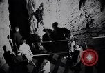 Image of Queen Elizabeth and Prince Philip visit caves New Zealand, 1954, second 57 stock footage video 65675037984