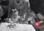 Image of first birthday of Nancy Gayle born to dwarf parents Austin Texas USA, 1950, second 29 stock footage video 65675038032
