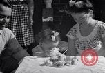 Image of first birthday of Nancy Gayle born to dwarf parents Austin Texas USA, 1950, second 60 stock footage video 65675038032