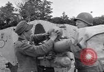 Image of German POW explains artillery to American soldier France, 1944, second 46 stock footage video 65675038185