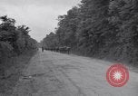Image of 1st Infantry march past church of Sainte Marie du Mont Sainte Marie du Mont France, 1944, second 3 stock footage video 65675038186
