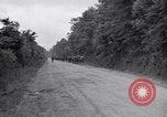 Image of 1st Infantry march past church of Sainte Marie du Mont Sainte Marie du Mont France, 1944, second 4 stock footage video 65675038186