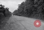 Image of 1st Infantry march past church of Sainte Marie du Mont Sainte Marie du Mont France, 1944, second 5 stock footage video 65675038186