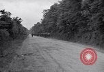 Image of 1st Infantry march past church of Sainte Marie du Mont Sainte Marie du Mont France, 1944, second 6 stock footage video 65675038186