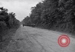 Image of 1st Infantry march past church of Sainte Marie du Mont Sainte Marie du Mont France, 1944, second 7 stock footage video 65675038186