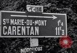 Image of 1st Infantry march past church of Sainte Marie du Mont Sainte Marie du Mont France, 1944, second 8 stock footage video 65675038186