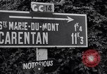 Image of 1st Infantry march past church of Sainte Marie du Mont Sainte Marie du Mont France, 1944, second 10 stock footage video 65675038186