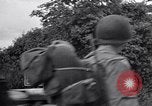 Image of 1st Infantry march past church of Sainte Marie du Mont Sainte Marie du Mont France, 1944, second 14 stock footage video 65675038186