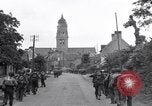 Image of 1st Infantry march past church of Sainte Marie du Mont Sainte Marie du Mont France, 1944, second 20 stock footage video 65675038186