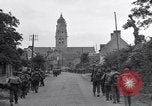 Image of 1st Infantry march past church of Sainte Marie du Mont Sainte Marie du Mont France, 1944, second 21 stock footage video 65675038186