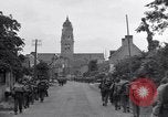 Image of 1st Infantry march past church of Sainte Marie du Mont Sainte Marie du Mont France, 1944, second 22 stock footage video 65675038186