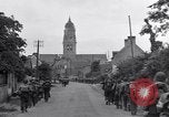 Image of 1st Infantry march past church of Sainte Marie du Mont Sainte Marie du Mont France, 1944, second 23 stock footage video 65675038186