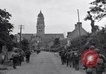 Image of 1st Infantry march past church of Sainte Marie du Mont Sainte Marie du Mont France, 1944, second 24 stock footage video 65675038186