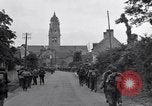 Image of 1st Infantry march past church of Sainte Marie du Mont Sainte Marie du Mont France, 1944, second 27 stock footage video 65675038186