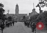 Image of 1st Infantry march past church of Sainte Marie du Mont Sainte Marie du Mont France, 1944, second 28 stock footage video 65675038186