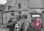 Image of 1st Infantry march past church of Sainte Marie du Mont Sainte Marie du Mont France, 1944, second 31 stock footage video 65675038186