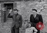 Image of 1st Infantry march past church of Sainte Marie du Mont Sainte Marie du Mont France, 1944, second 37 stock footage video 65675038186