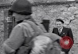 Image of 1st Infantry march past church of Sainte Marie du Mont Sainte Marie du Mont France, 1944, second 38 stock footage video 65675038186
