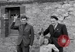 Image of 1st Infantry march past church of Sainte Marie du Mont Sainte Marie du Mont France, 1944, second 39 stock footage video 65675038186