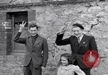 Image of 1st Infantry march past church of Sainte Marie du Mont Sainte Marie du Mont France, 1944, second 40 stock footage video 65675038186
