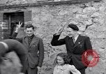 Image of 1st Infantry march past church of Sainte Marie du Mont Sainte Marie du Mont France, 1944, second 41 stock footage video 65675038186